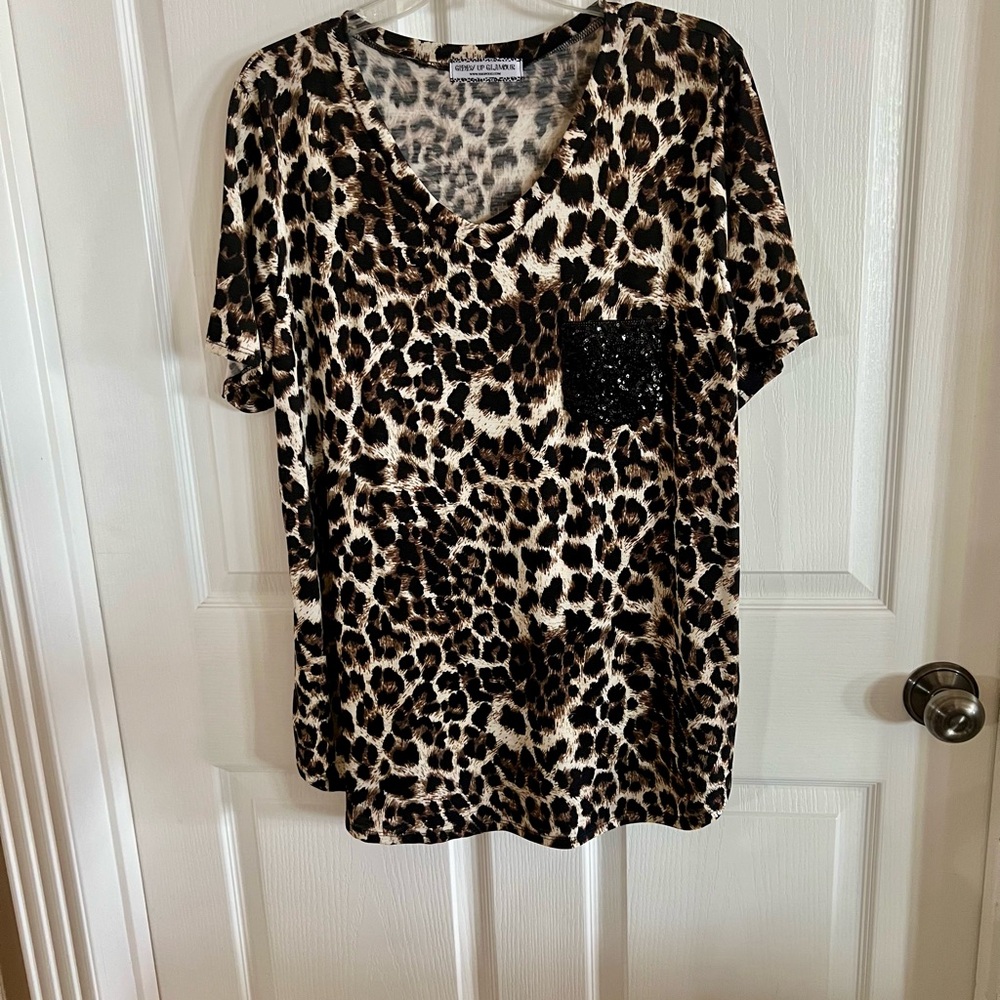 PRICE REDUCED!!!!!
Leopard Print Women's Top with Black Sequin Pocket.